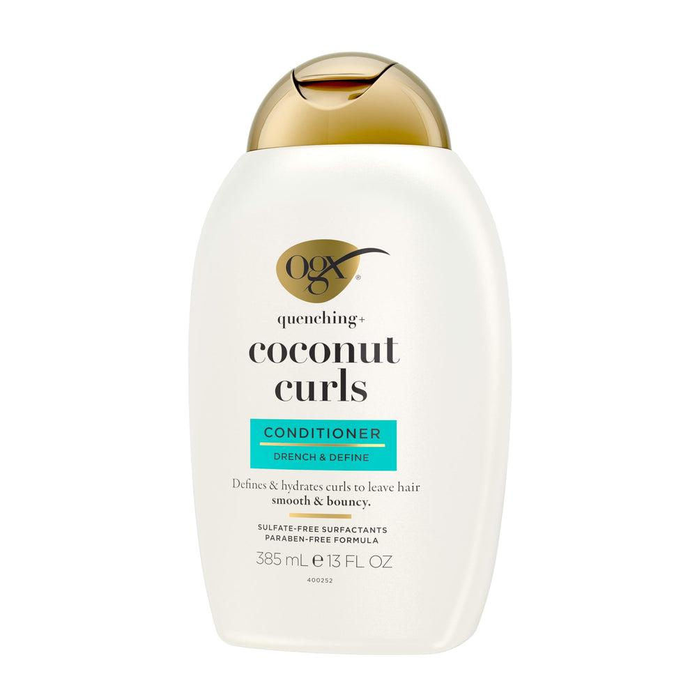 OGX Quenching Coconut Curls bottle on shelf hints of citrus and honey.