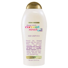OGX Reparación de daño con champú Coco Milagroso en botella, devuelve suavidad y brillo al cabello dañado.