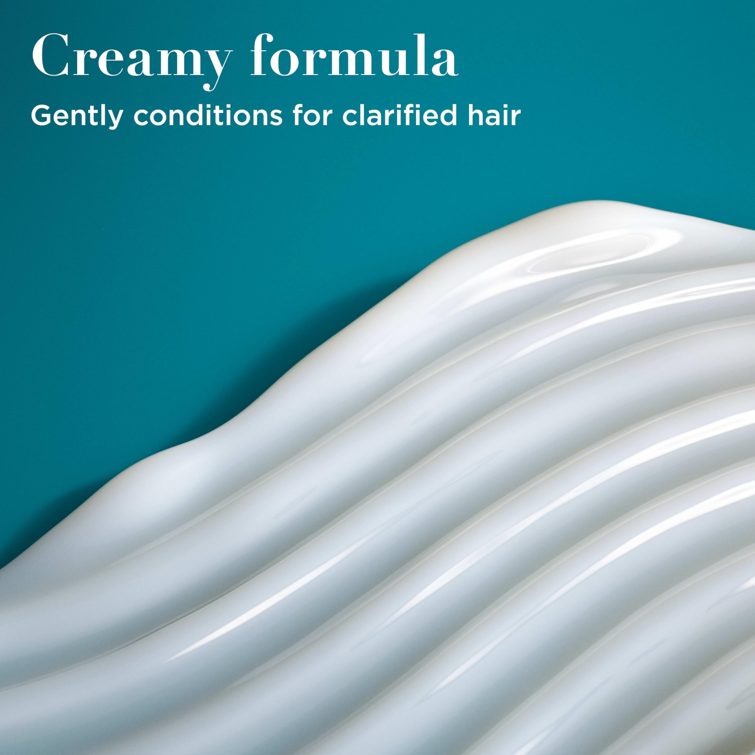 Hair appears shiny and refreshed after using OGX Rosemary Mint Conditioner