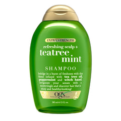 OGX Teatree Mint Shampoo bottle pours for a refreshing scalp cleanse.