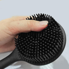 OHOO back massage bristle side helps soothe skin while stimulating circulation in the shower.