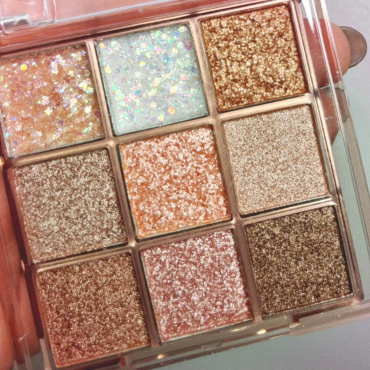 Okerker Paleta sombras con destellos 9 colores para looks versátiles.