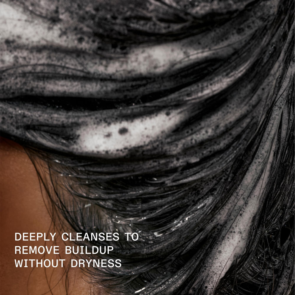 Olaplex 4C rinse moment illustrates impurities washed away for brighter hair.