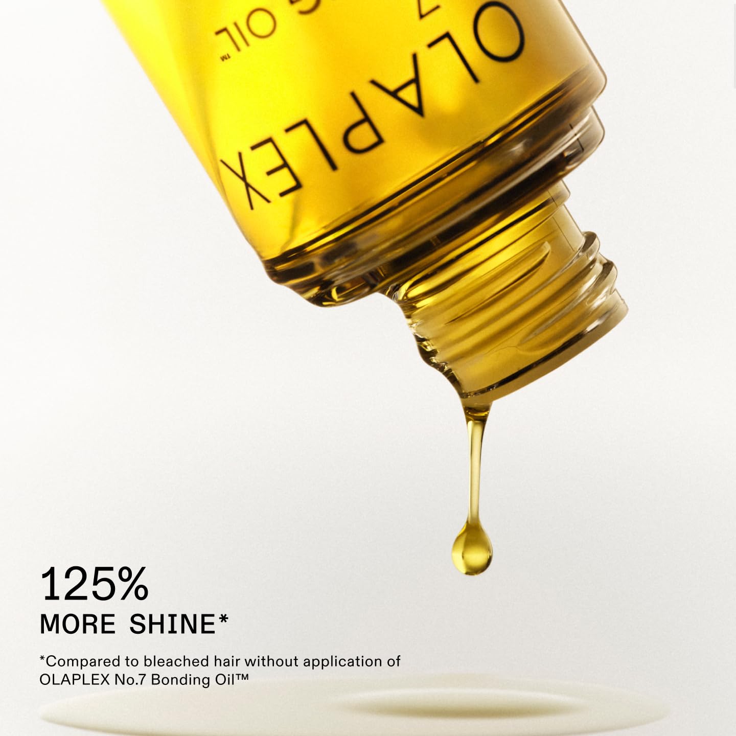 Olaplex No.7 Bonding Oil applied to damp hair for shine and styling
