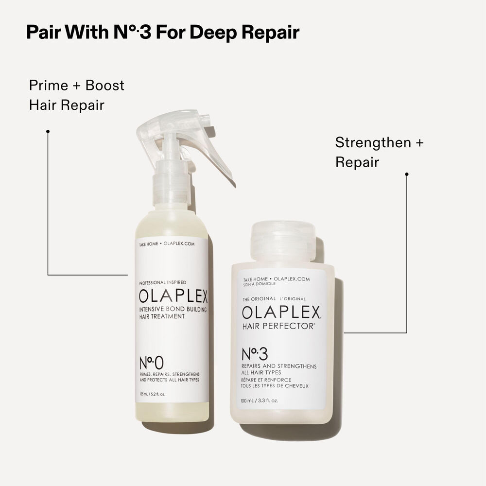 Product being dispensed from Olaplex No. 0 bottle in a stream.