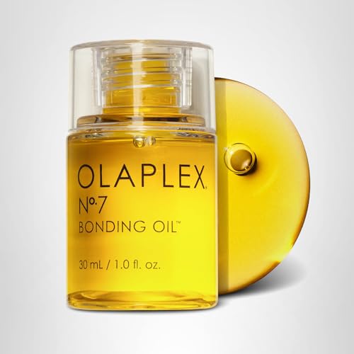 Compact Olaplex No. 7 bottle in a beauty setup signaling daily shine.