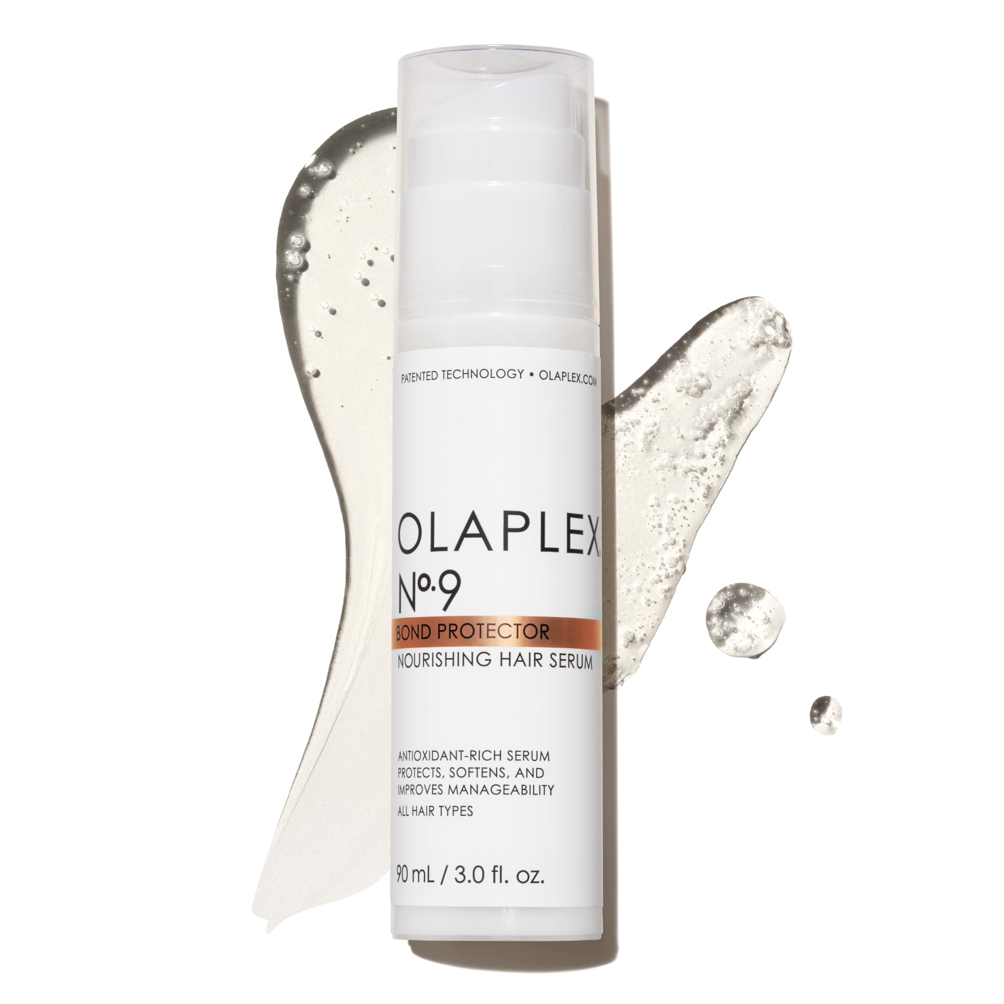 Olaplex No. 9 bond protector serum bottle pouring for smooth tangles and shine.
