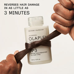 Olaplex No.3 beside damaged hair context suggesting repair potential