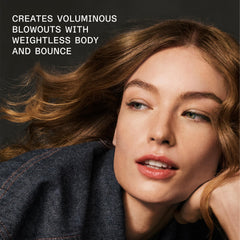 Olaplex Volumizing Blow Dry Mist applied to hair for smooth texture and heat protection
