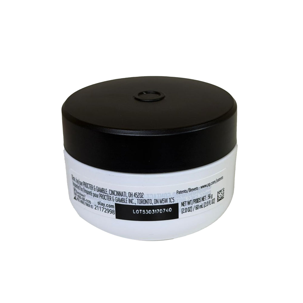 Olay Age Defying Renewal jar on hand, ideal for refreshing dry skin.