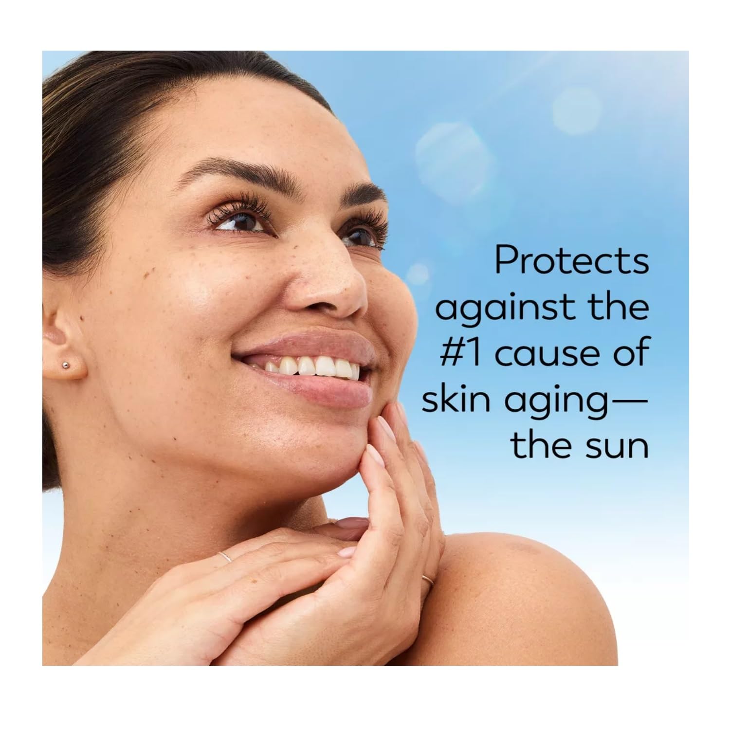 Olay Complete SPF 15 cream being smoothed onto the face for quick absorption.