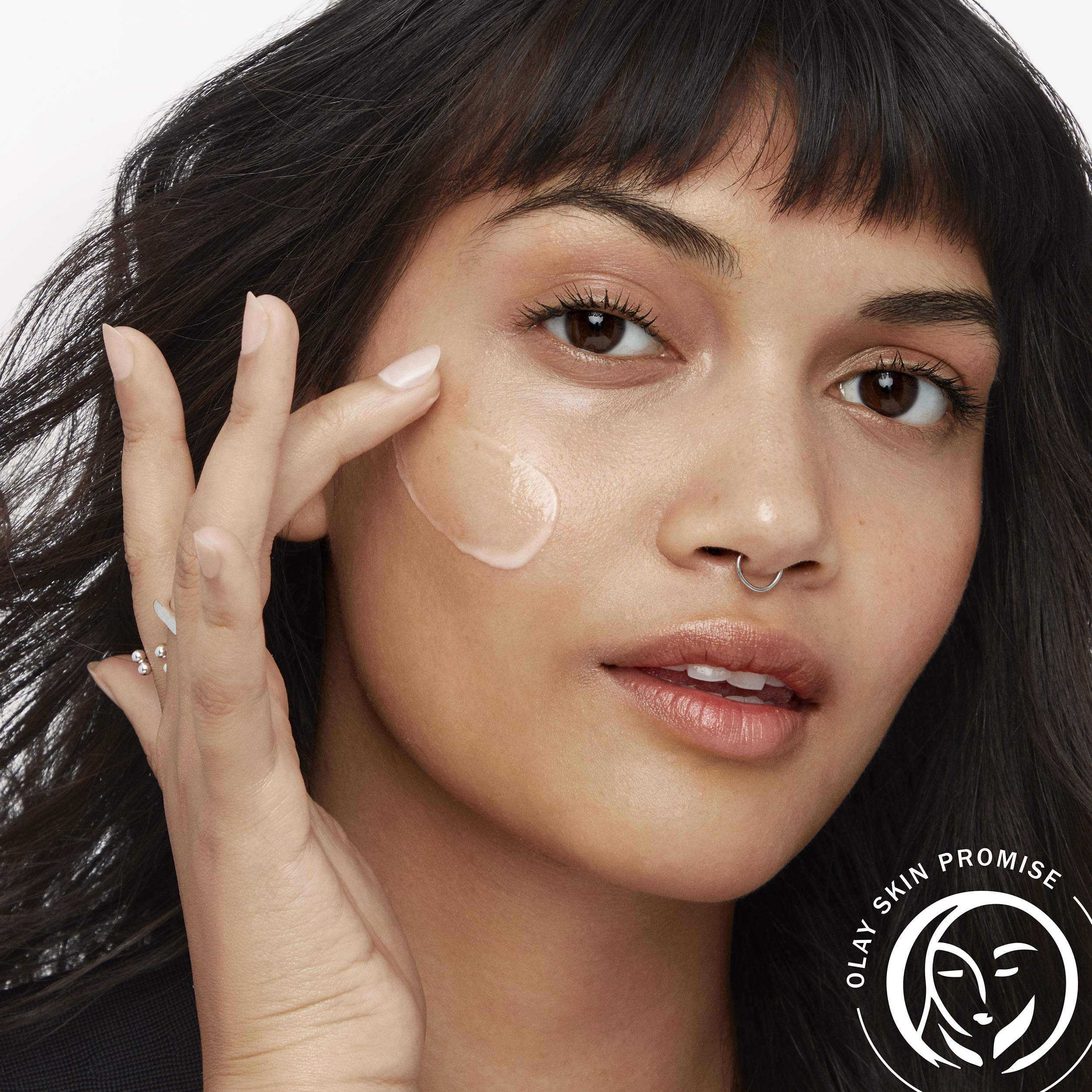 Olay Regenerist Micro-Sculpting Serum applied to the face for smooth skin.