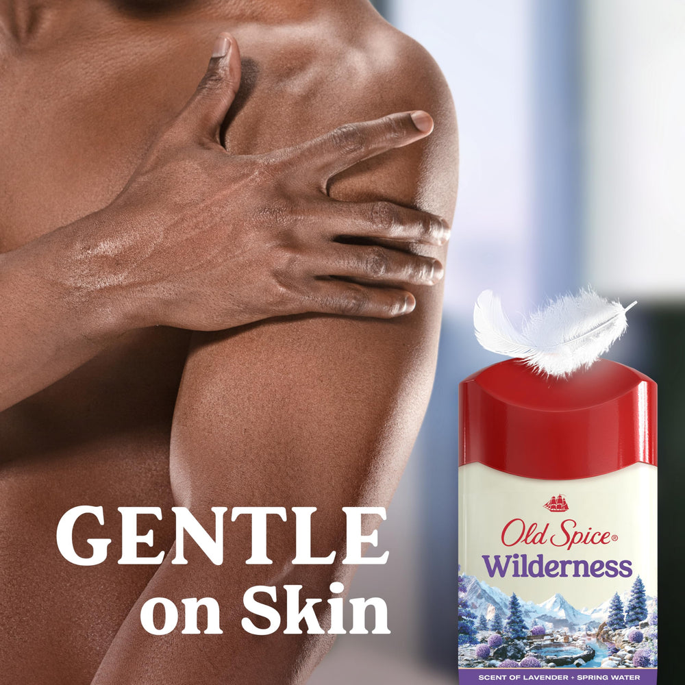 User applying Old Spice Dry Feel to underarm for 24/7 odor protection.