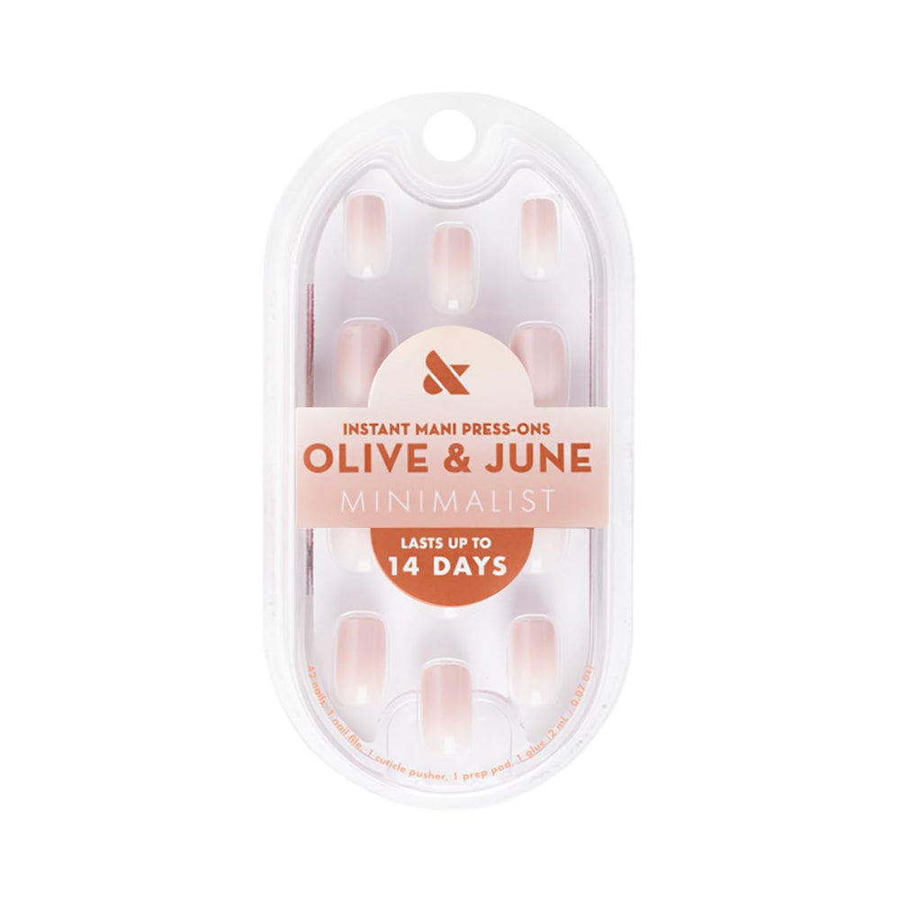Close-up of Olive and June Instant Mani glue application process for secure wear.