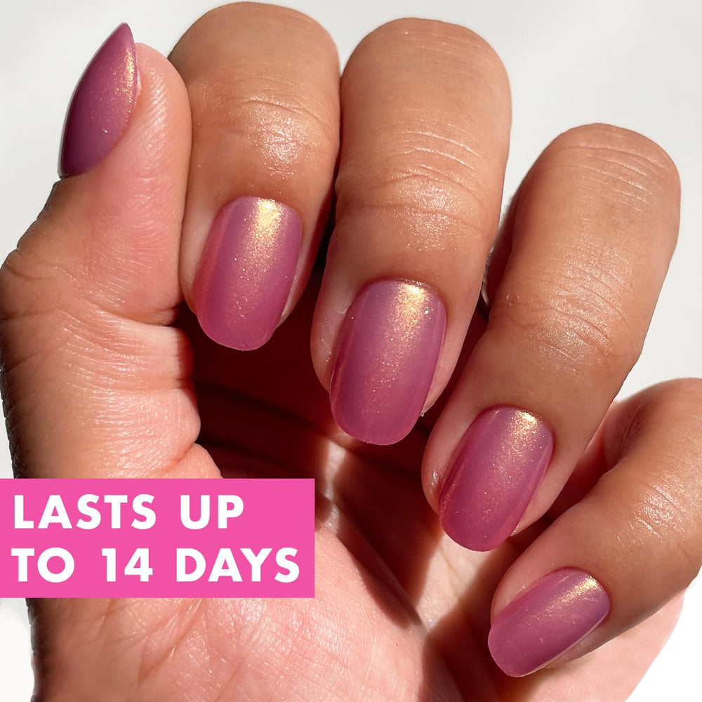 Olive & June Instant Mani: pegamento no toxico para fijación segura.