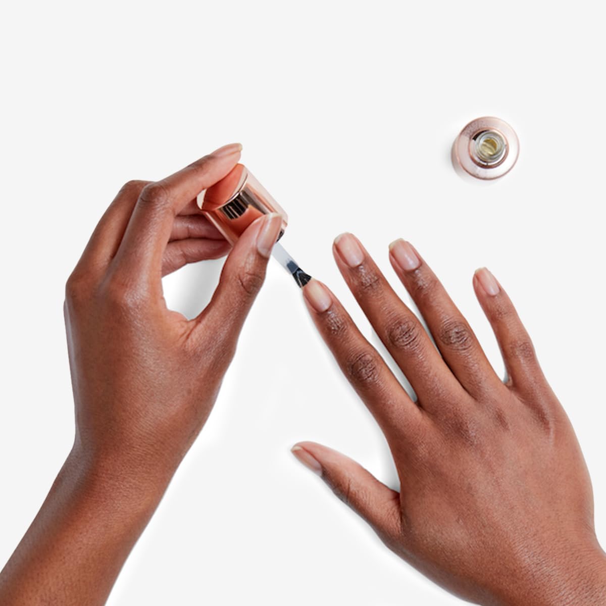 Olive & June Nail Primer brush-application for a smooth coat