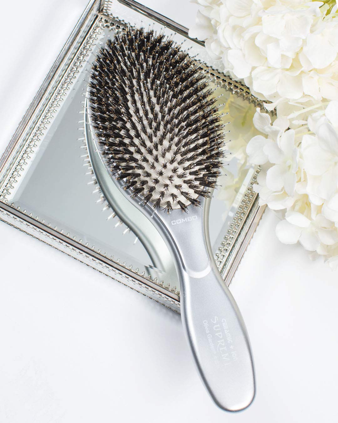 Olivia Garden travel-friendly paddle brush for on-the-go styling