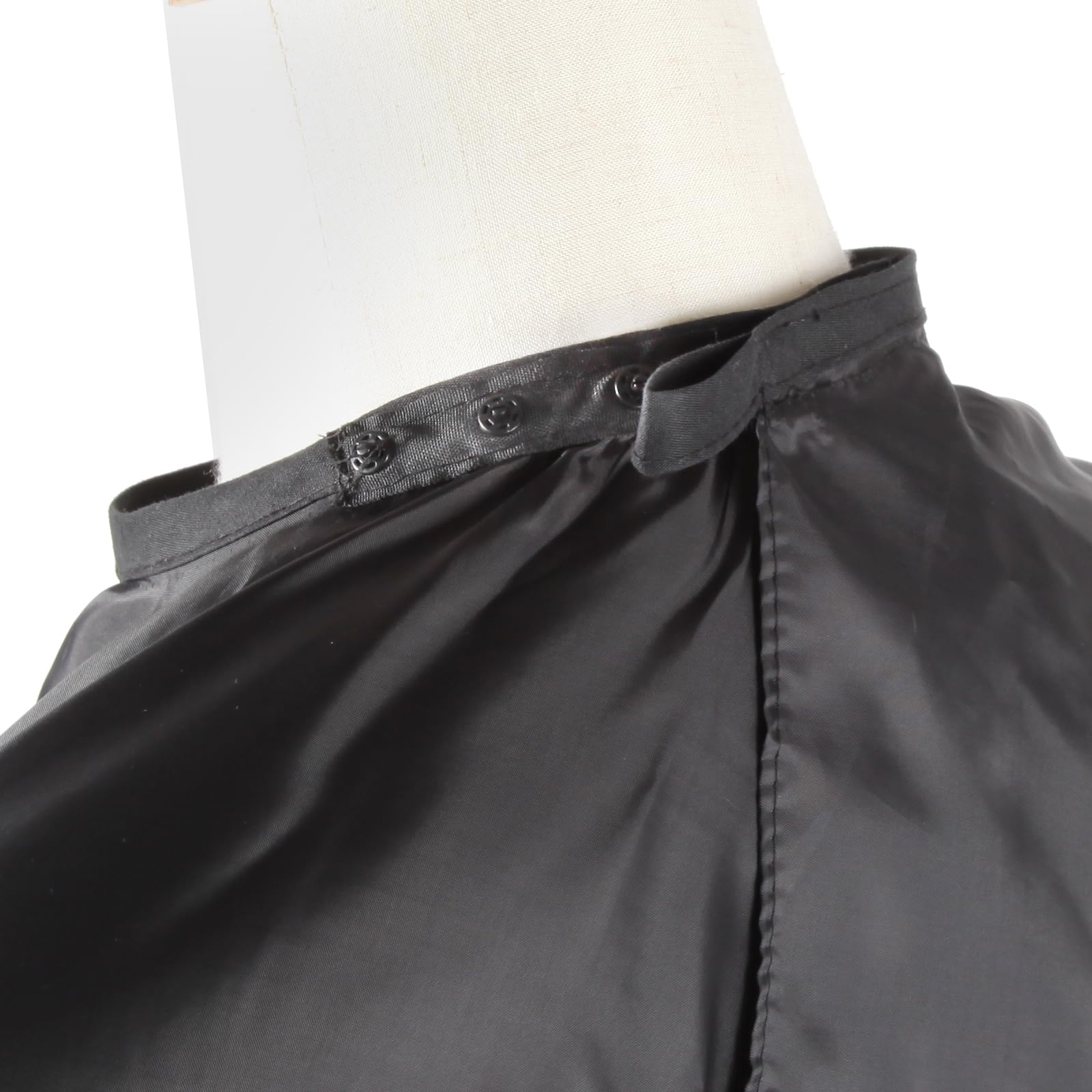 Omvoina 57x51 inch black cape provides full body protection.