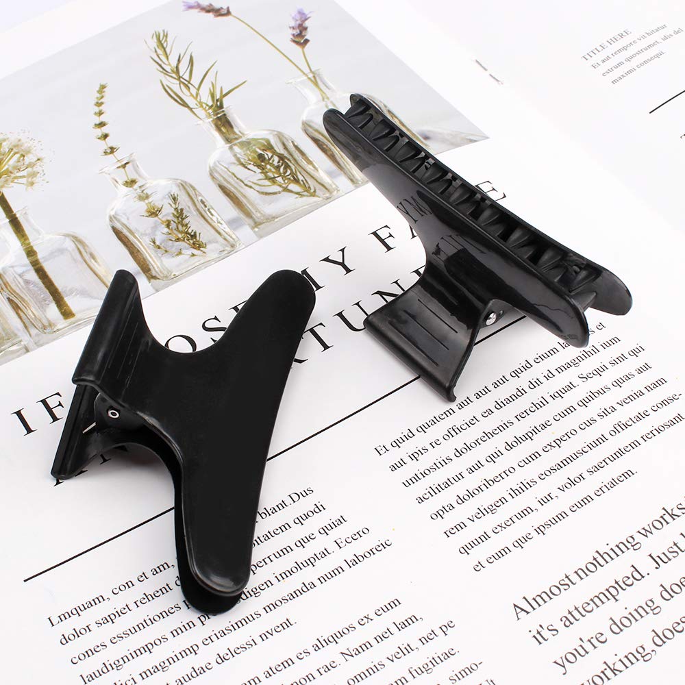 Ondder hair-sectioning clip during cutting provides precise control.