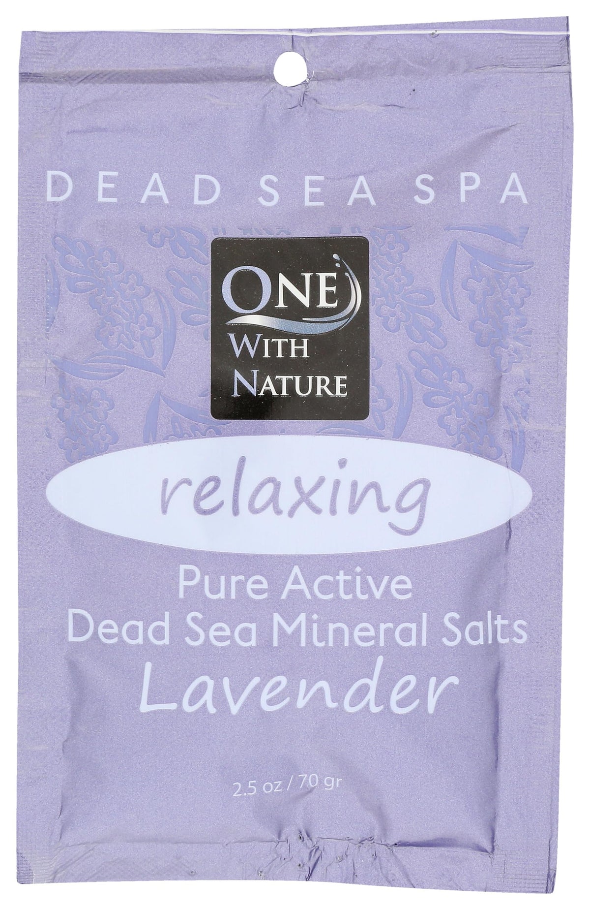 One With Nature Dead Sea salts in lavender bath tub for relaxing bath and skin balance.