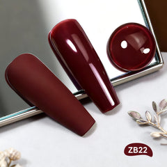 OpenLive nail polish brush applying glossy dark red color for a professional manicure.