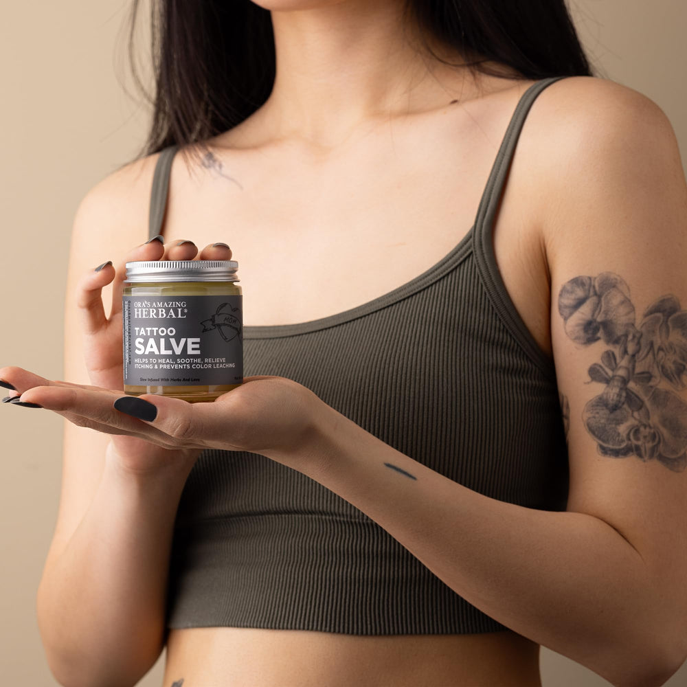 Close-up of Ora's Tattoo Salve texture showing balm-like moisture for skin