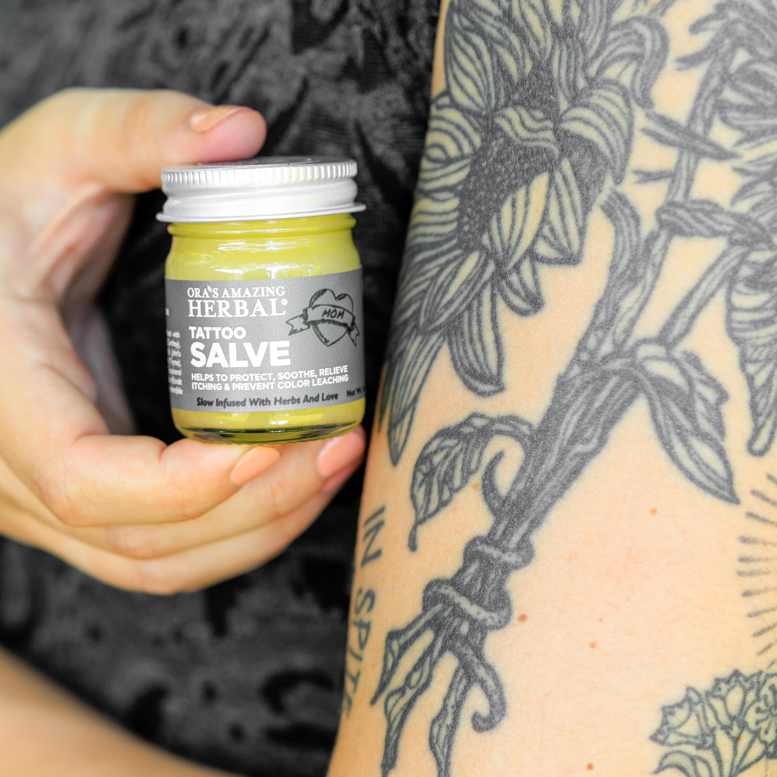Ora's Amazing Herbal Tattoo Salve on tattoo area during aftercare