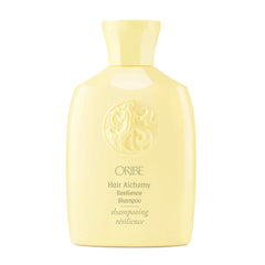 Oribe Alchemy Resilience Champú, botella vertiendo, limpieza suave y fortalecimiento del cabello.