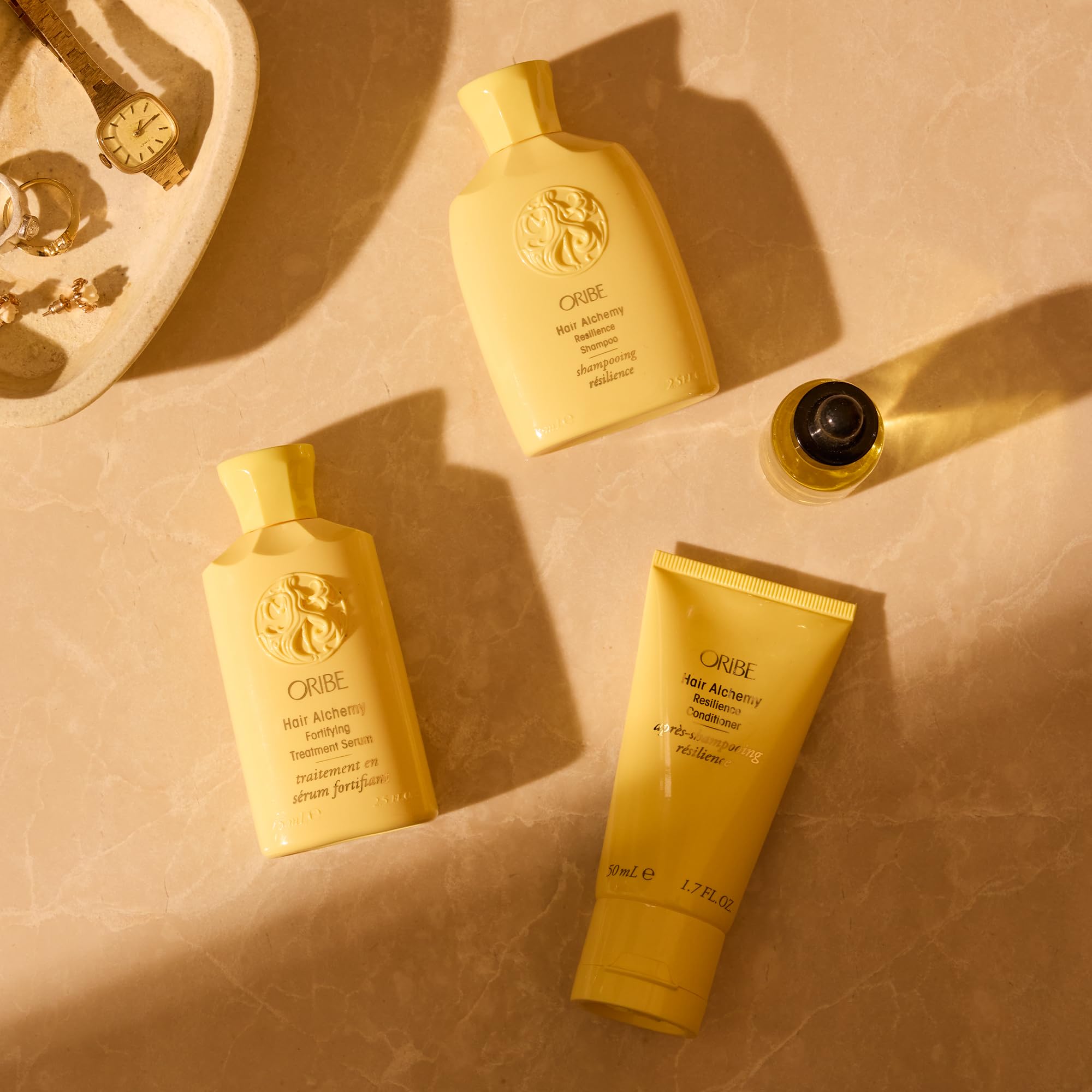 Oribe Alchemy Resilience Champú, uso diario, revitaliza y fortalece desde la raíz.