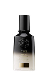 Oribe Balm D'Or Heat Shield bottle shown for heat styling protection and shine.