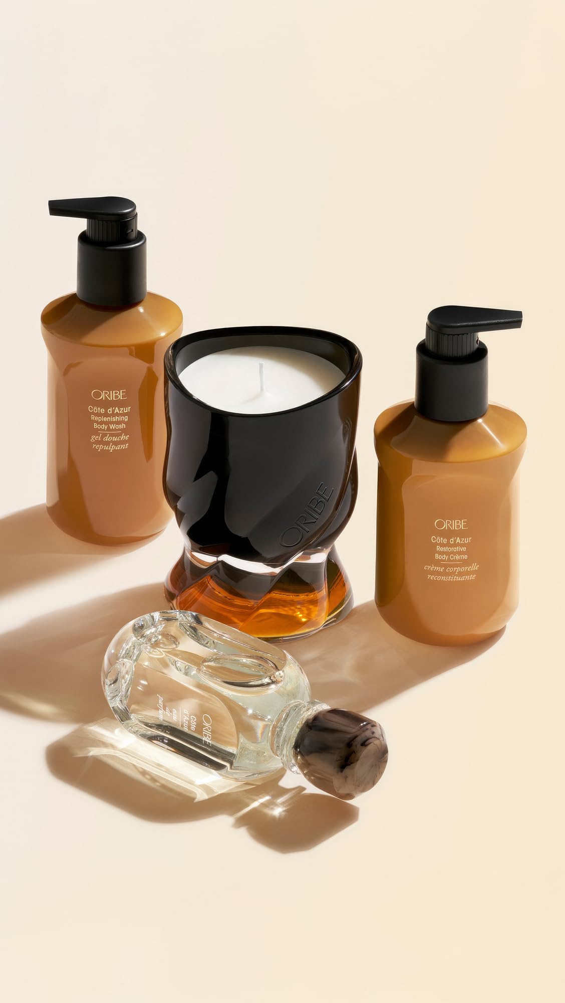 Oribe Côte d’Azur replenishing body wash product display suggests spa-like indulgence.
