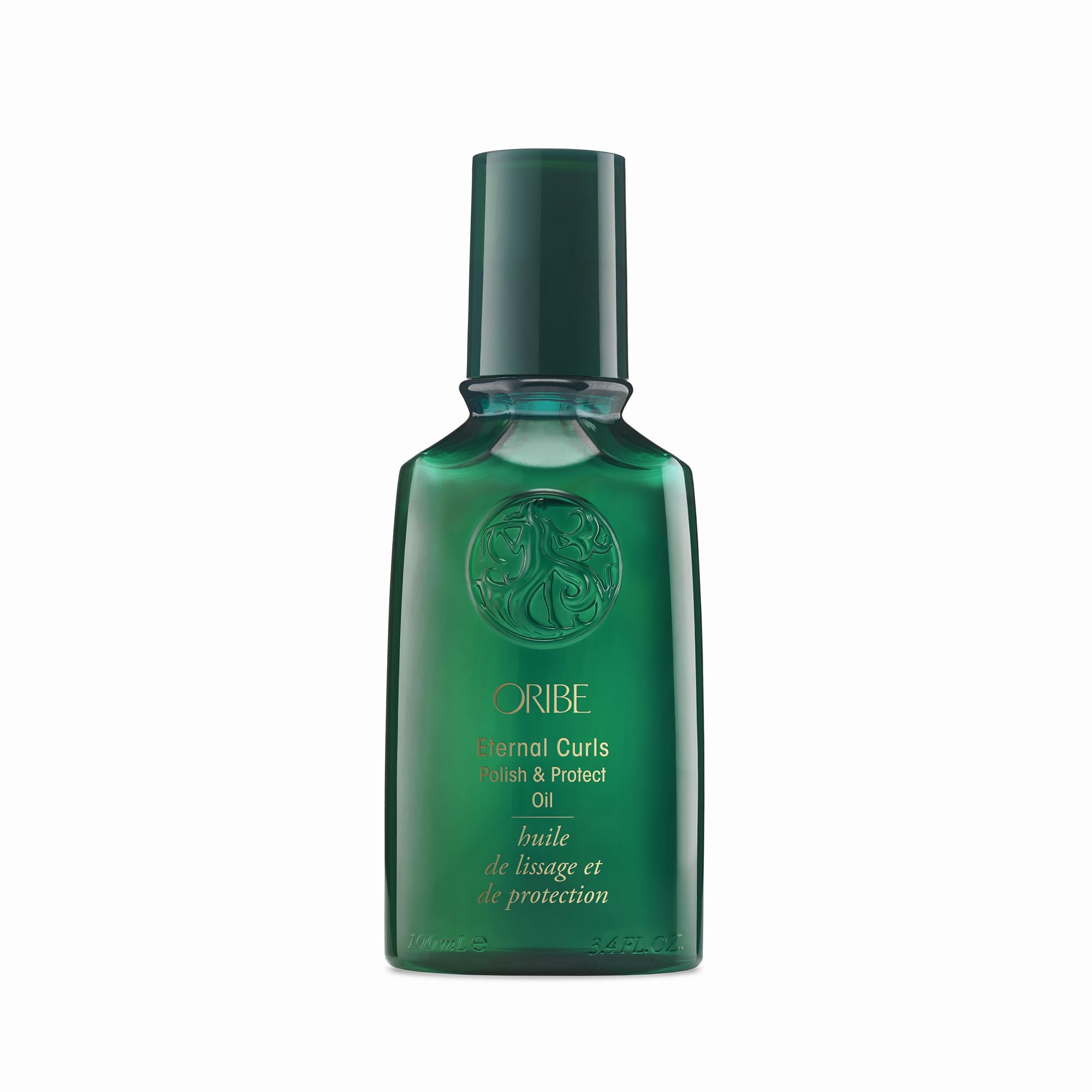 Oribe Eternal Curls Polish & Protect Oil bottle on vanity highlights frizz control and shine.