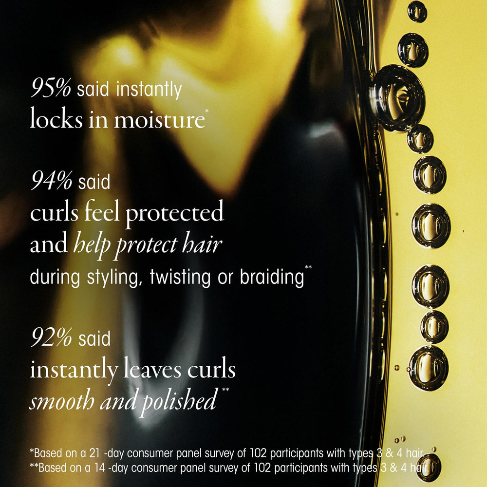 Oribe Eternal Curls Polish & Protect Oil drop on palm illustrates nourishing texture.