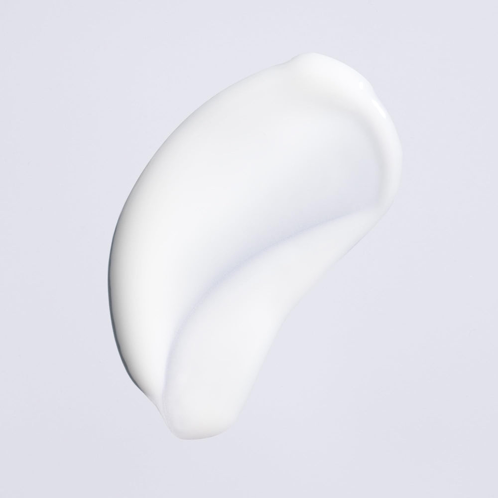 Oribe Feather Balm soft shine finish reveals weightless glow.