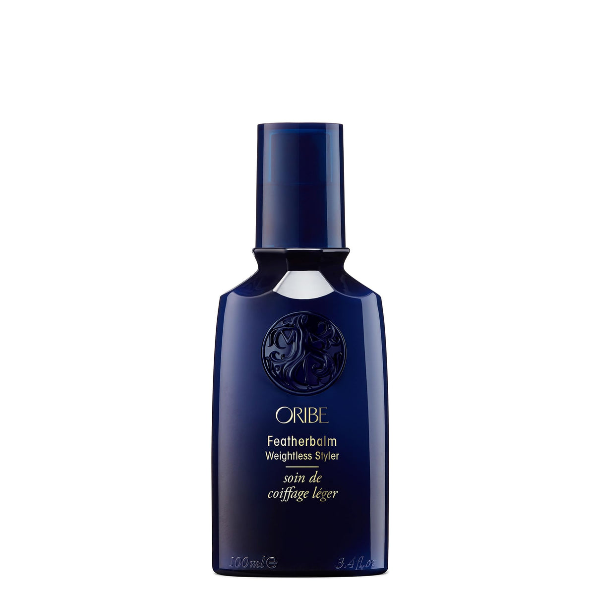 Oribe Feather Balm Ultra Light Bottle showcases weightless shine for fine hair.