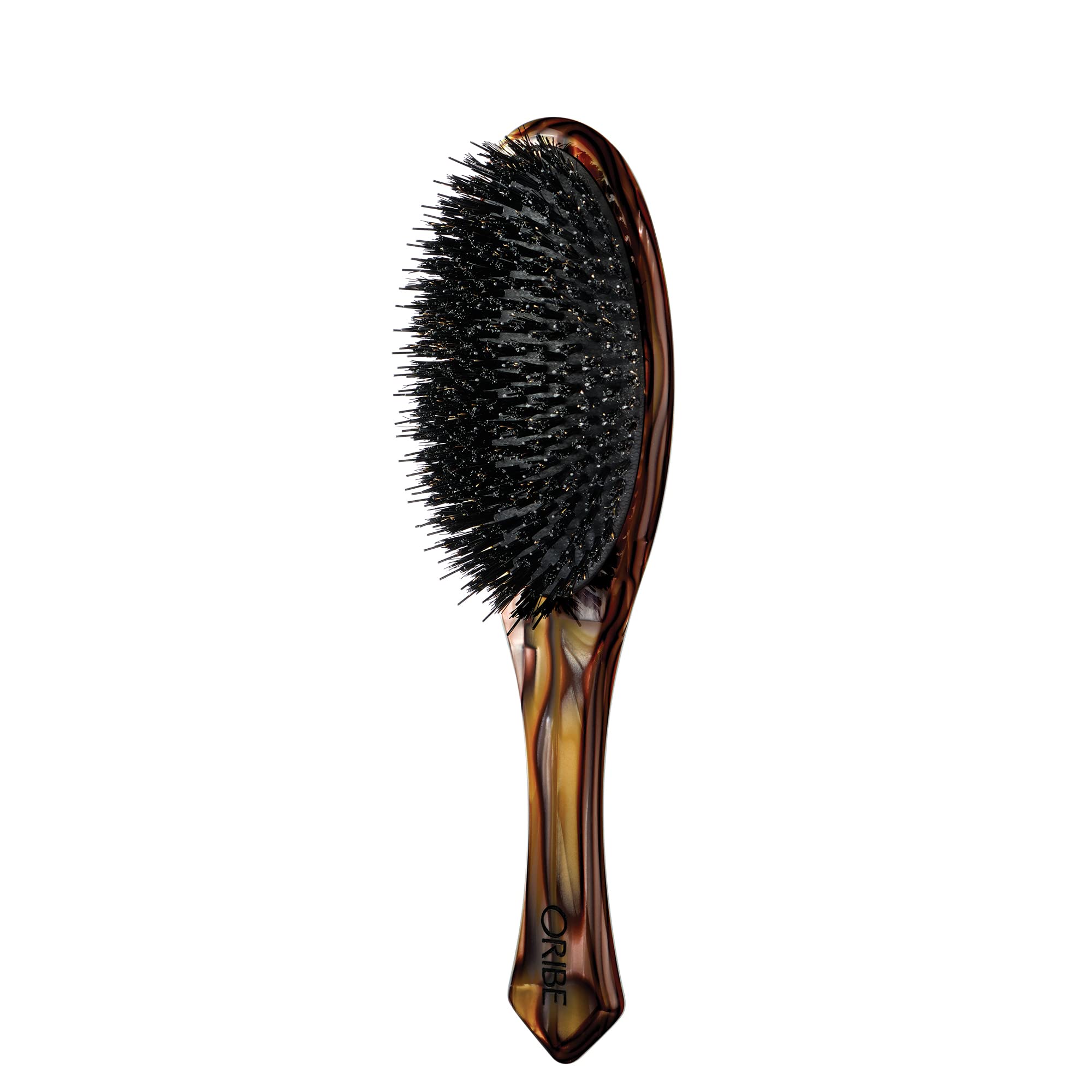 Oribe Flat Brush with Italian resin handle shows sleek design and comfortable grip.