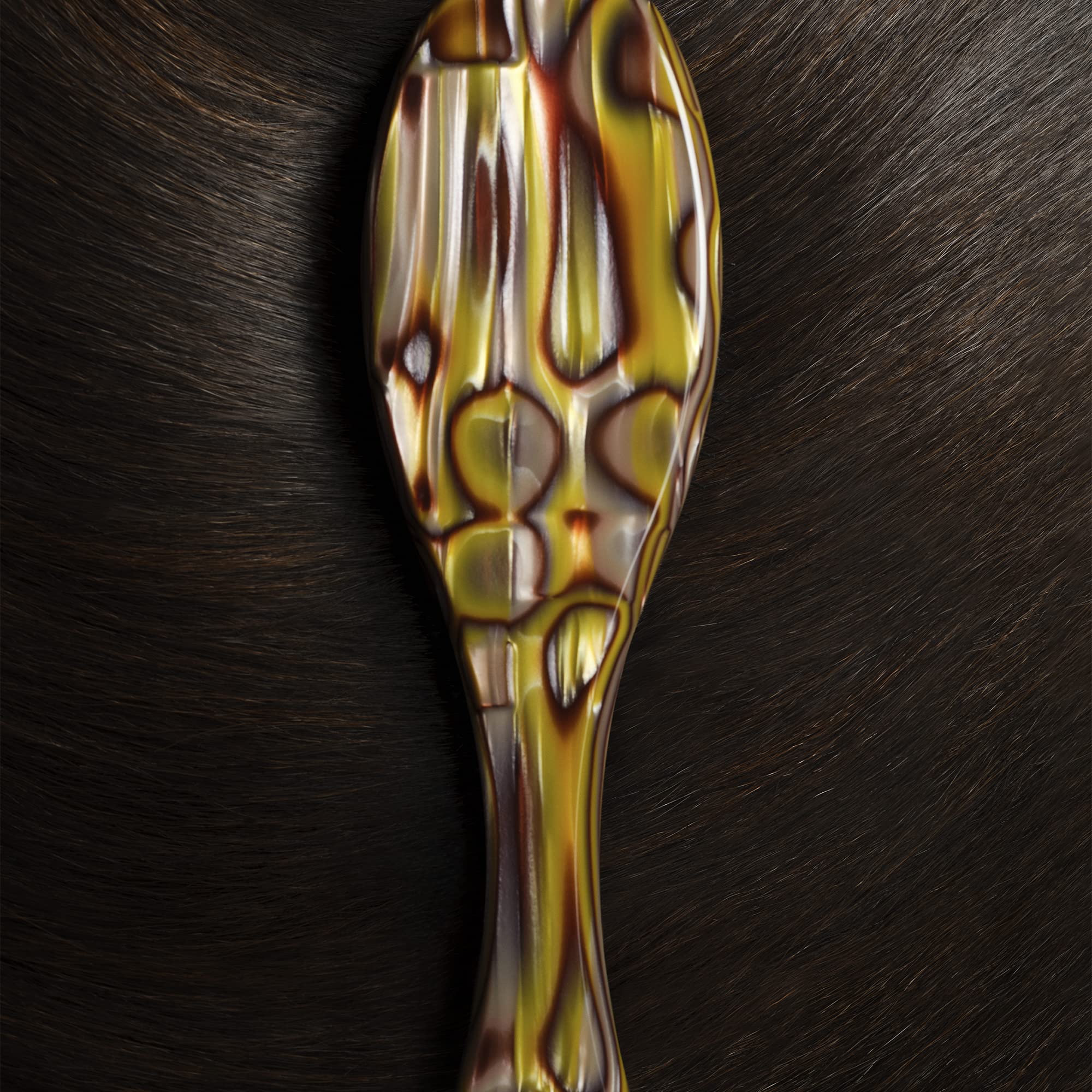 Oribe Flat Brush in action delivering a smooth, polished finish.