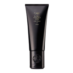 Oribe Gel Radiance Magic and Hold Serum bottle showing shine and flexible hold.