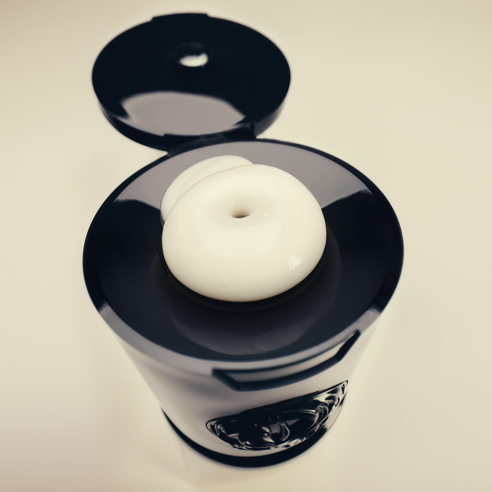 Oribe Gold Lust cypress extract close-up signaling moisture and renewal.