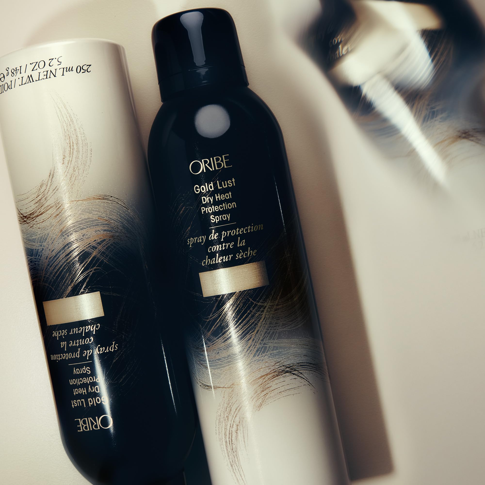 Oribe Gold Lust bottle demonstrates heat protection results after styling sessions