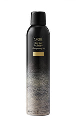 Oribe Gold Lust Dry Shampoo bottle absorbing oil for refreshed, weightless hair.