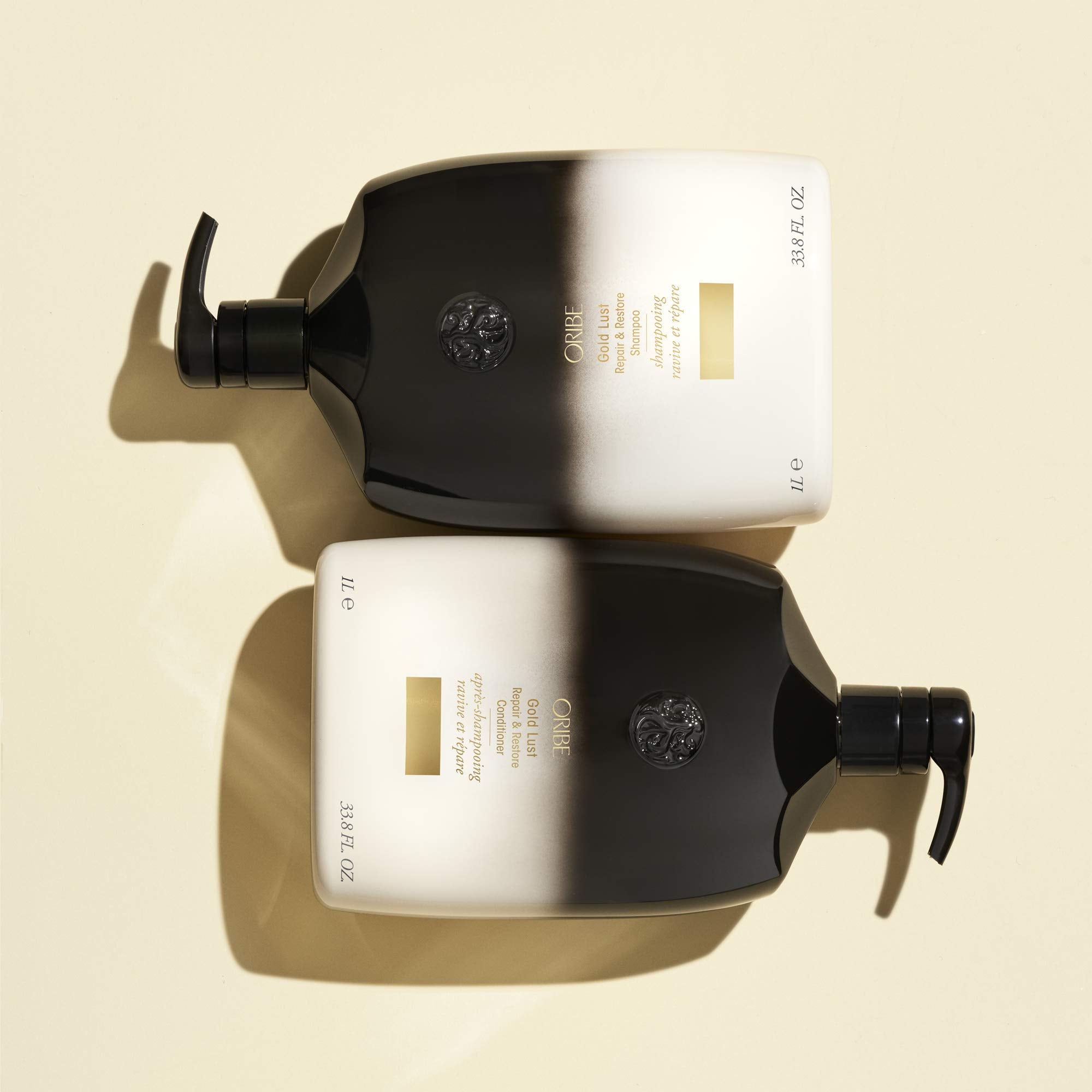 Oribe Gold Lust lather in hand demonstrating gentle cleansing.