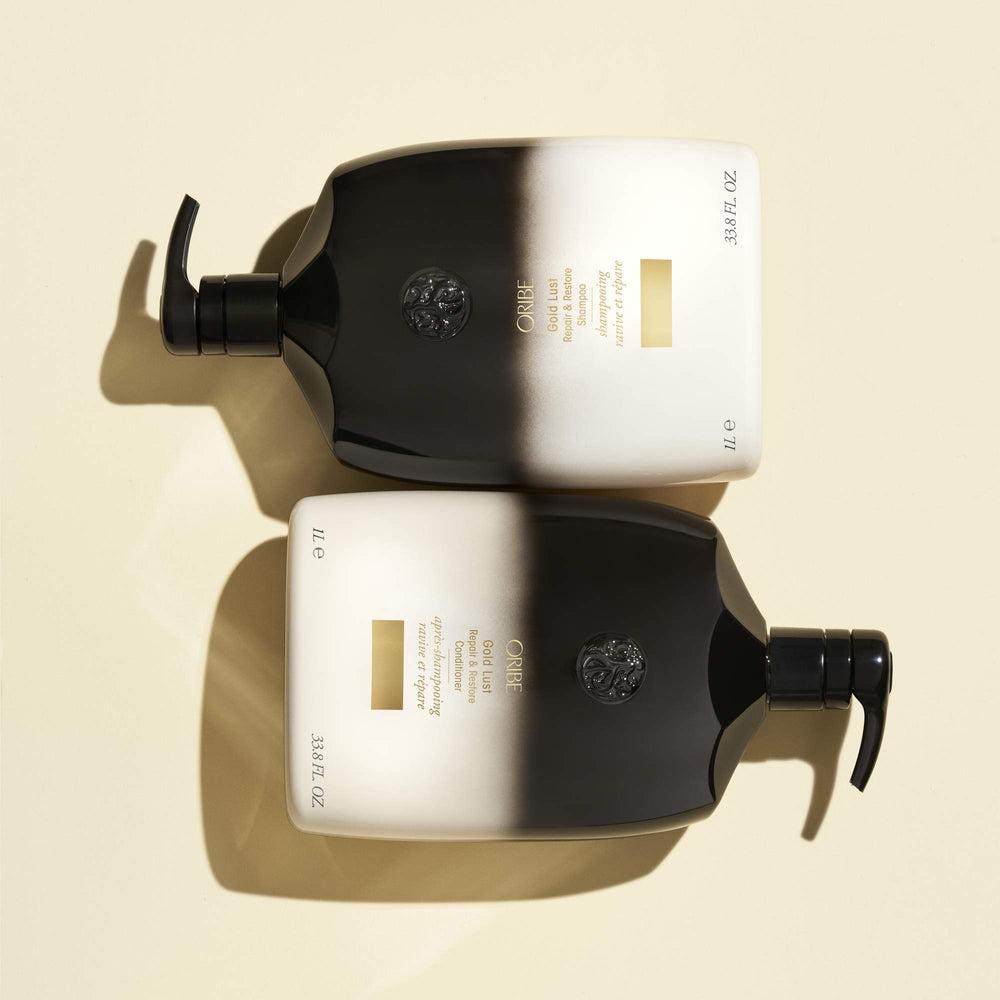 Oribe Gold Lust lather in hand demonstrating gentle cleansing.