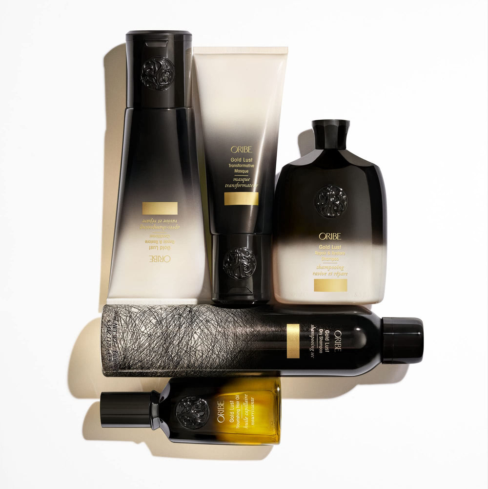 Oribe Gold Lust travel-ready jar on bathroom counter