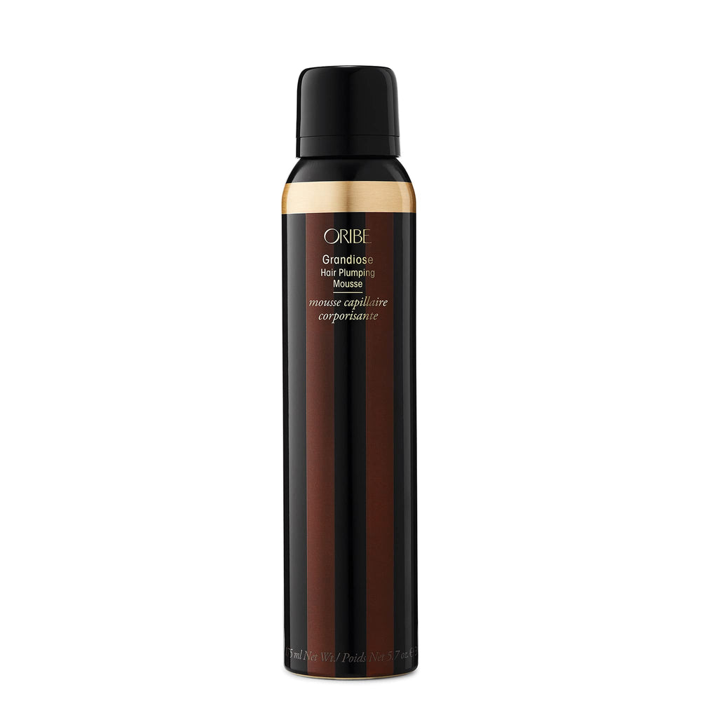 Oribe Grandiose Mousse bottle pump enabling easy volumizing styling.