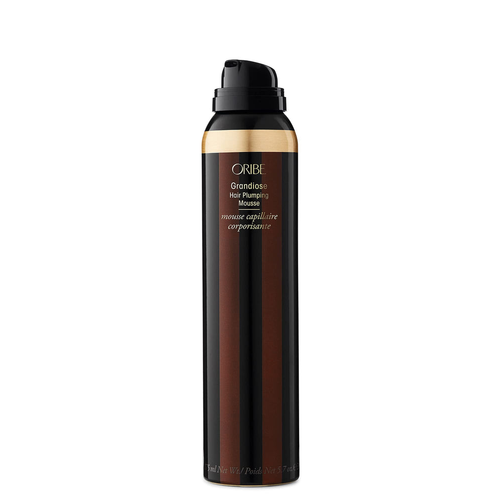 Oribe Grandiose Mousse hand-application ensures even distribution and lift.