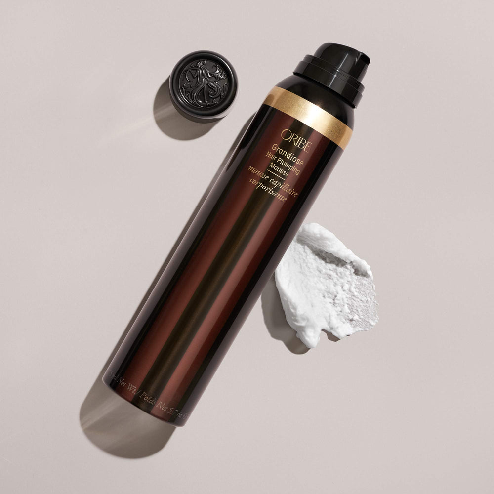 Oribe Grandiose Mousse styled hair showing thicker, voluminous, touchable look.
