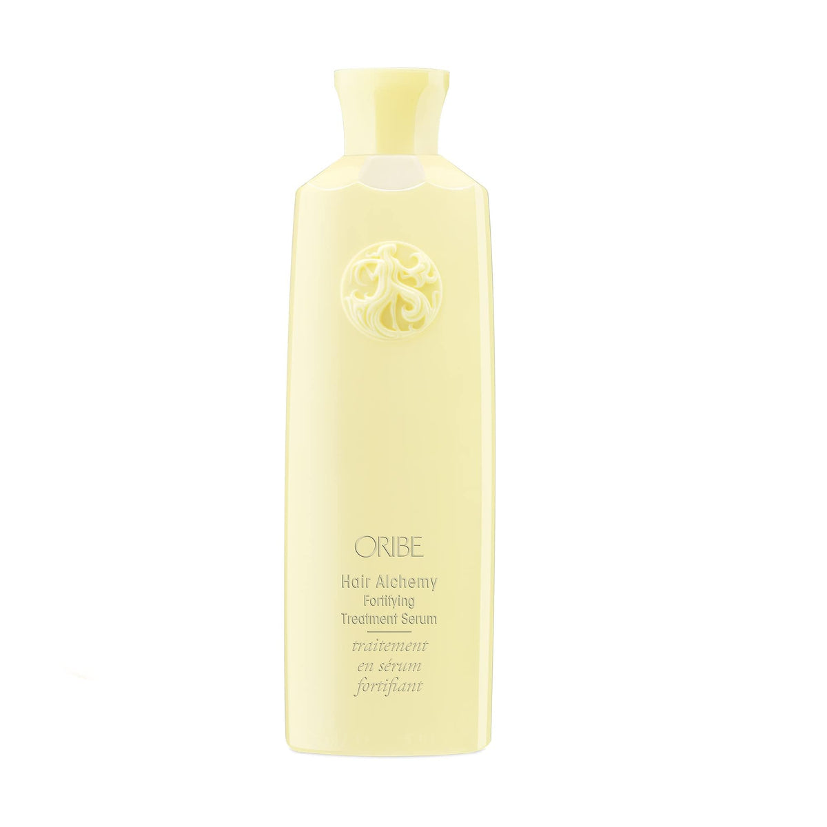 Oribe Hair Alchemy Fortifying Treatment bottle close-up showing conditioning serum for fragile hair