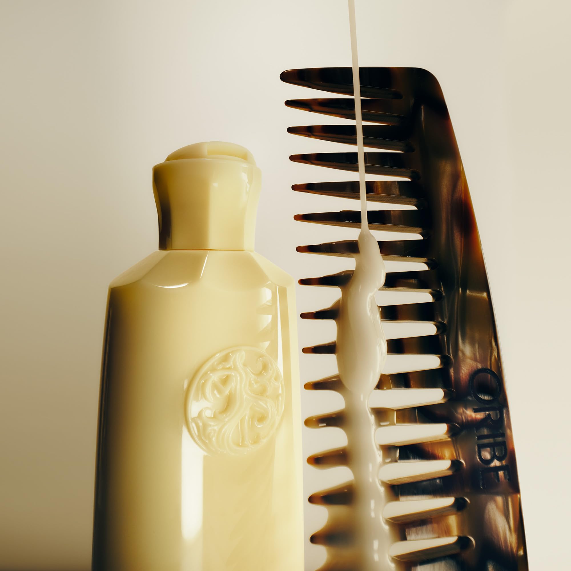 Oribe Hair Alchemy Fortifying Treatment bamboo leaf ingredient shot suggests lightweight protection