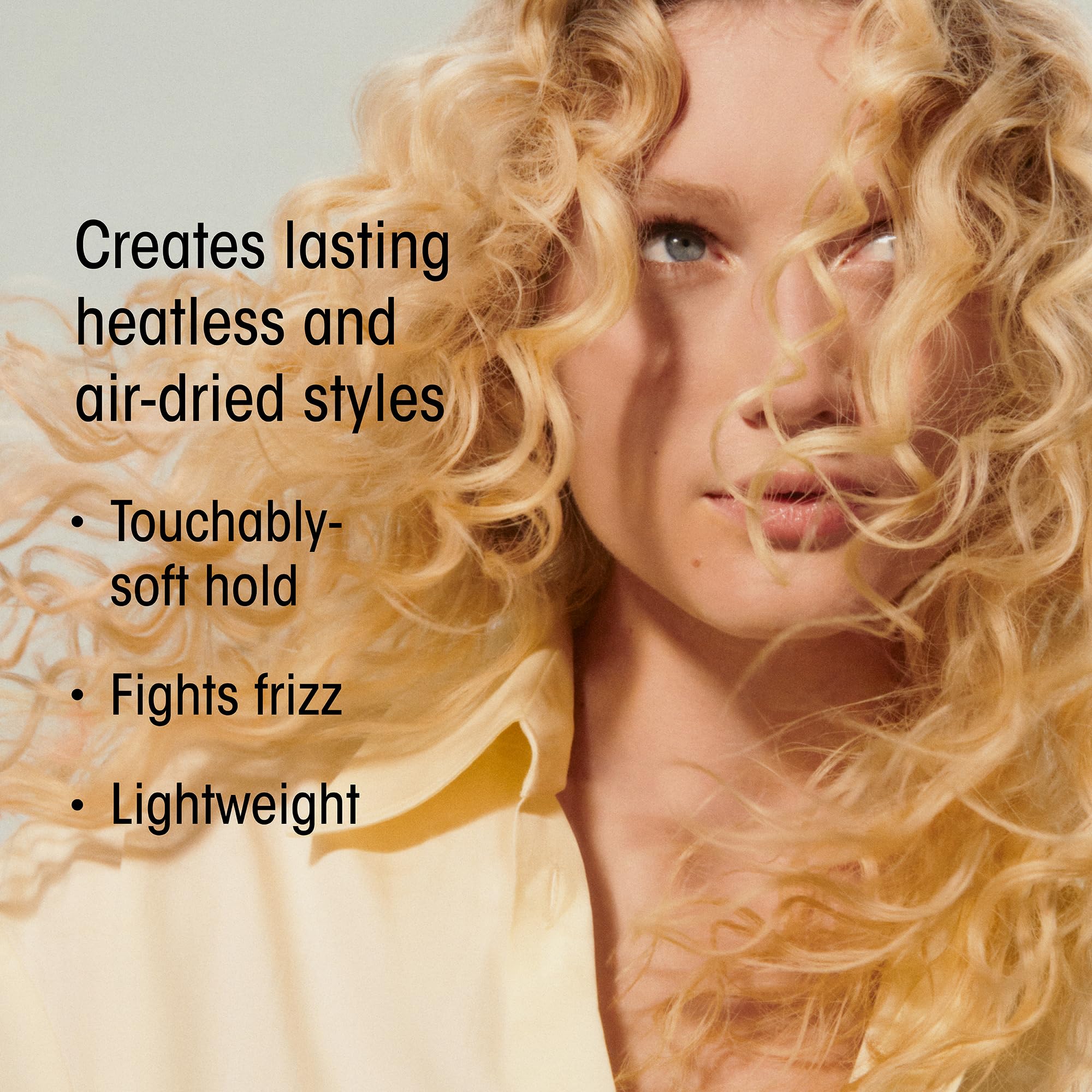 Oribe Hair Alchemy Balm reduces frizz for a polished look